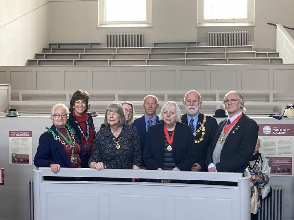 Some of the civic party in the old courtroom at the Shire Hall Museum