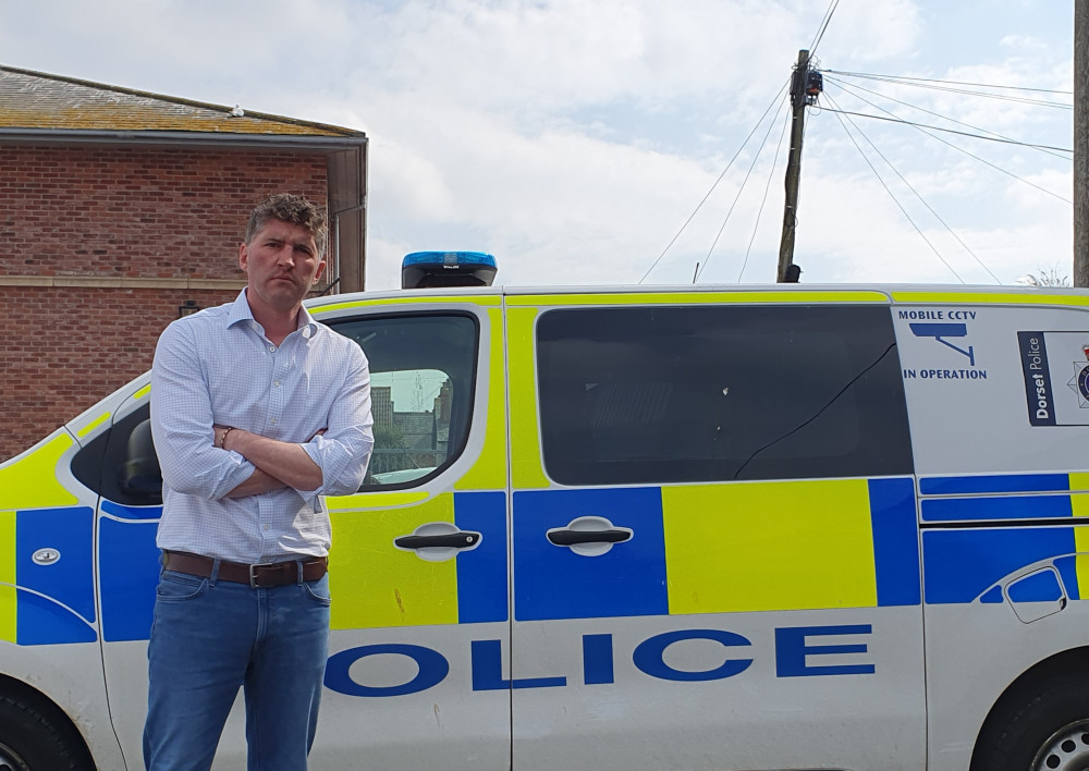 West Dorset Liberal Democrat parliamentary candidate Edward Morello with police van