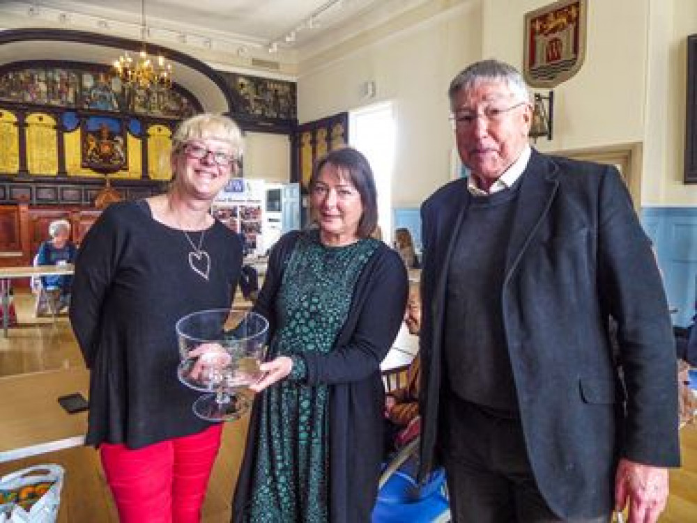 Martin Ridley of St Michael's Trading Estate presents the Clive Hayward Award to Miranda Robertson and Karen Bate of the West Dorset Magazine