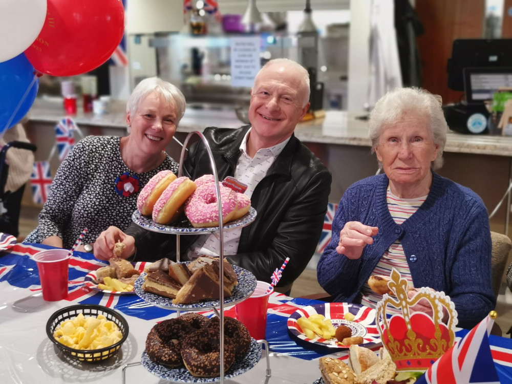 Belong Newcastle-under-Lyme resident, Edith Edwards (right), celebrates the Coronation with son, John, and daughter-in-law, Denise (Belong).