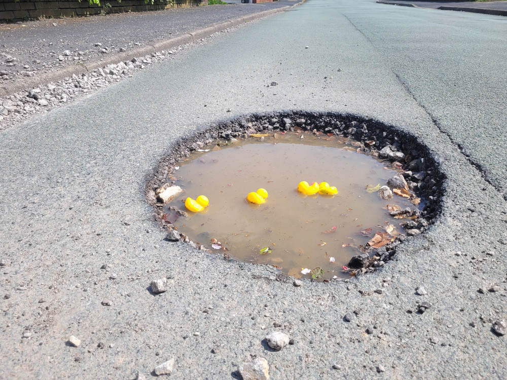 Residents have filled the Elmwood Drive pothole with rubber ducks  (LDR).