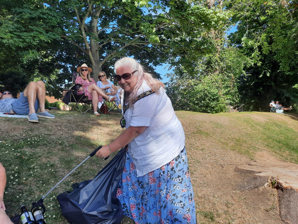 Sally-Anne litter picking at the music events in Cutts Close in 2022. Image credit: Nub News. 