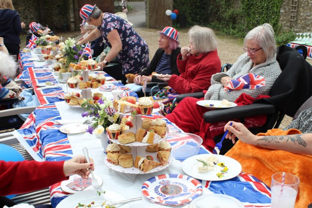 Residents at The Seaton care home celebrate with a tea party in the garden Residents at The Seaton care home celebrate with a tea party in the garden