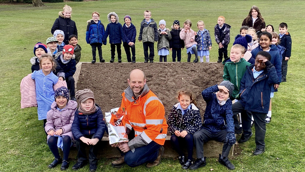 Children from St Clare’s Primary School and Belvoirdale Primary School with North West Leicestershire District Council’s Parks and Open Spaces Development Officer, Chris Killingback