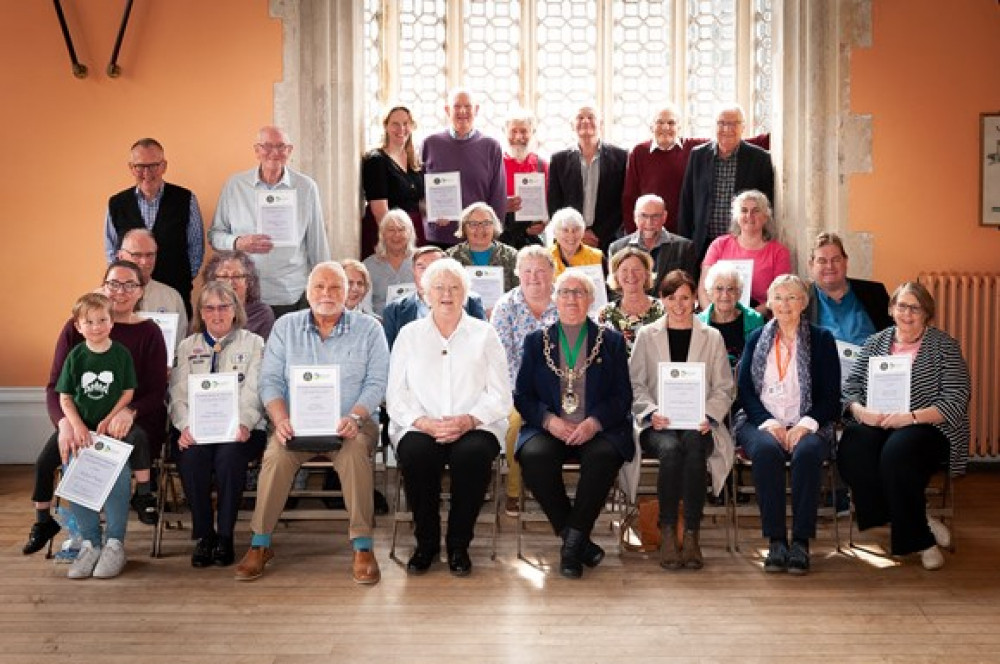 Community organisations which benefitted from the car boot fund, pictured at a celebration event this month with the Mayor of Dorchester, Cllr Janet Hewitt, and Cllr Molly Rennie