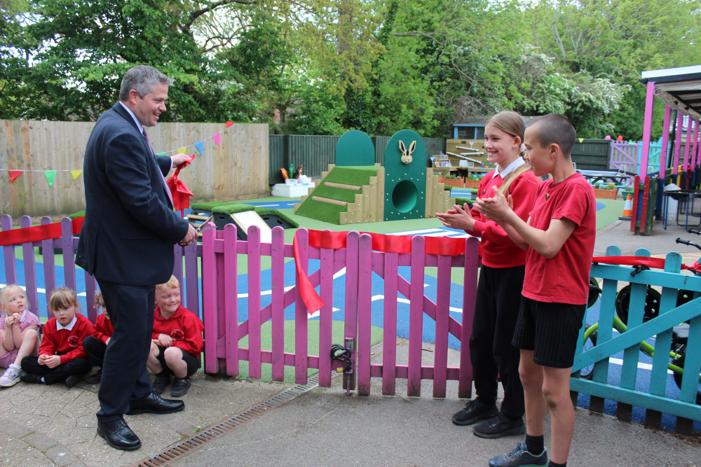 Cllr Marcus Hartnell cuts the ribbon to open the new play area