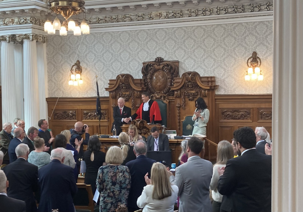 Lib Dem councillor Graham Greenalgh is elected as new Mayor of Stockport.  He shakes hands with ex-mayor, Cllr David Wilson (Image - Alasdair Perry)