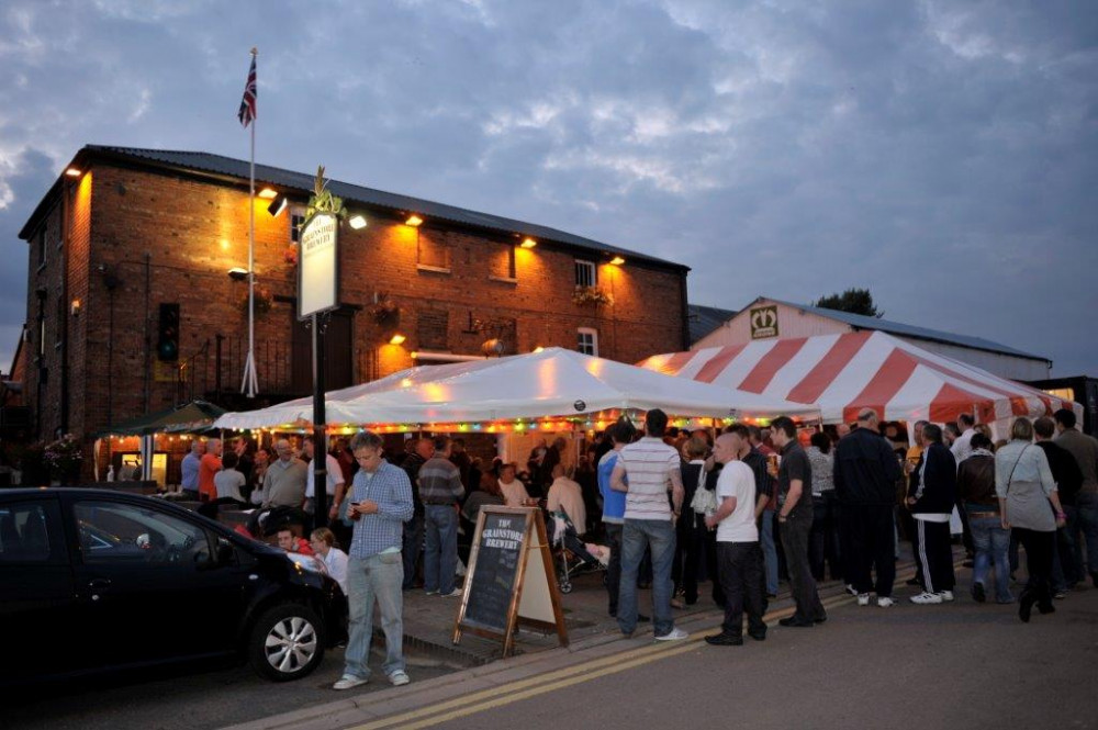 Enjoy a BBQ, huge range of cider and live music at The Grainstore. Image credit: The Grainstore. 