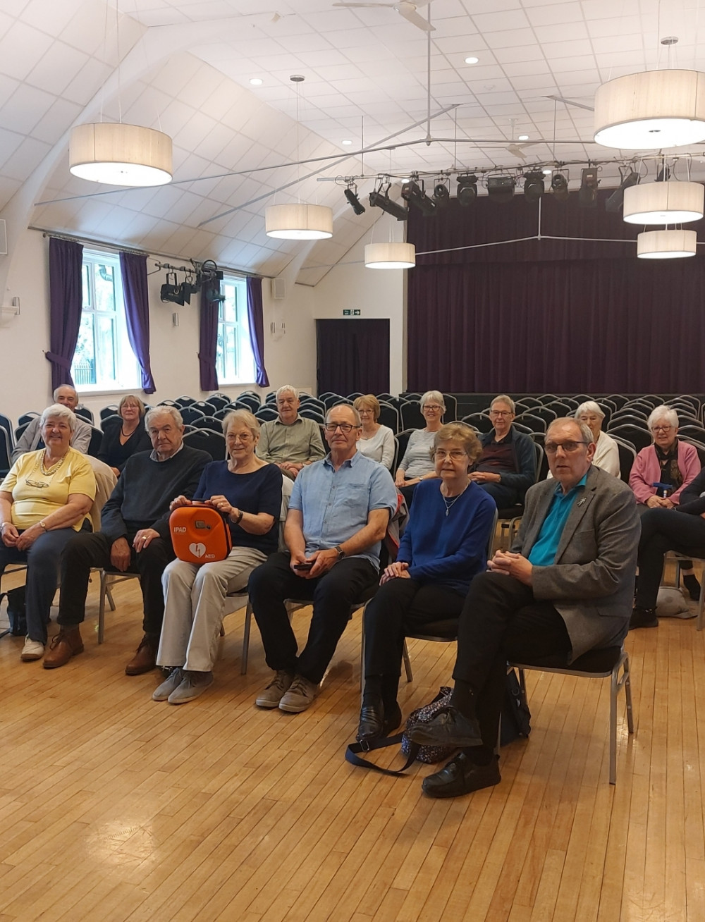 Members of the Hucknall U3A Science Group with the purchased defibrillator. Photo Credit: The John Godber Centre.