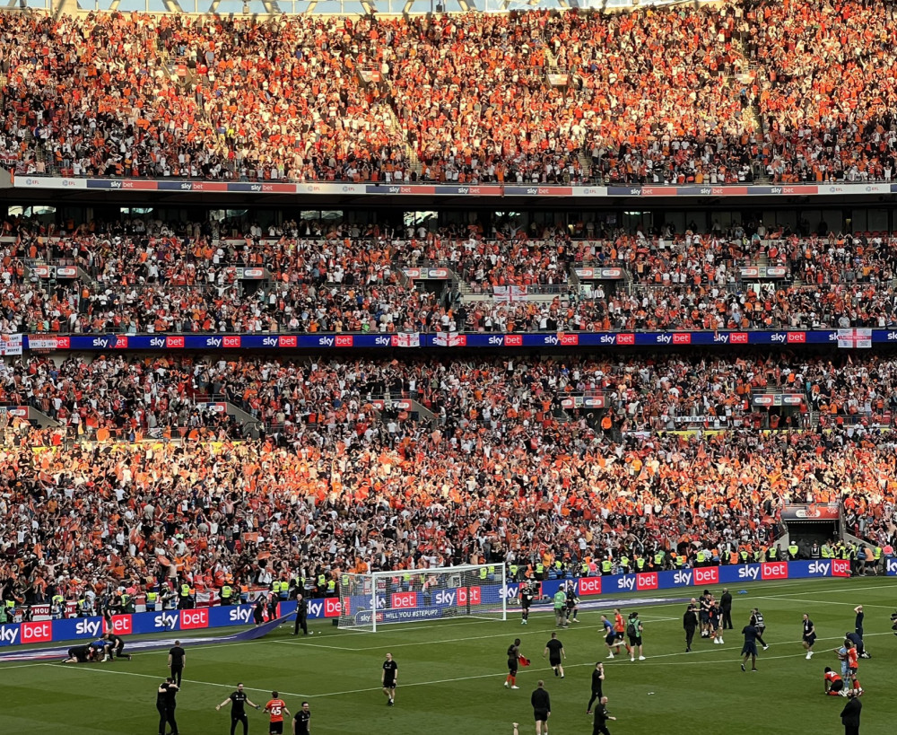 More than 40,000 joyous Luton Town fans celebrating victory at the end of a dramatic Championship Play-off final at Wembley on Saturday. CREDIT: @laythy29