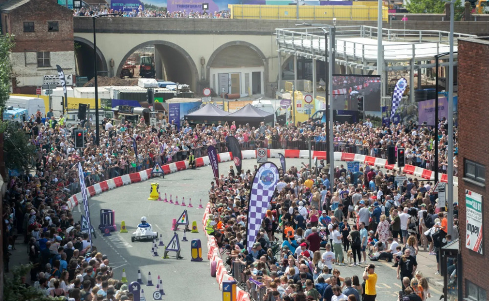 Over 15,000 spectators attended the Krazy Races soapbox race in Stockport town centre.  A racer is pictured here reaching the base of the slope down from St Peter's Square (Image - Krazy Races)