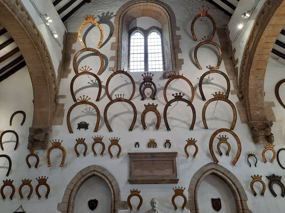 Oakham Castle has an impressive display of horseshoes, donated and gifted by nobility and royalty. Image credit: Nub News. 