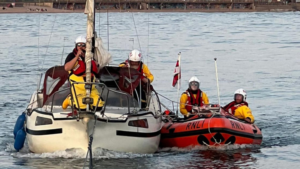 Exmouth inshore lifeboat escorting the vessel (Ed Steele/ RNLI)