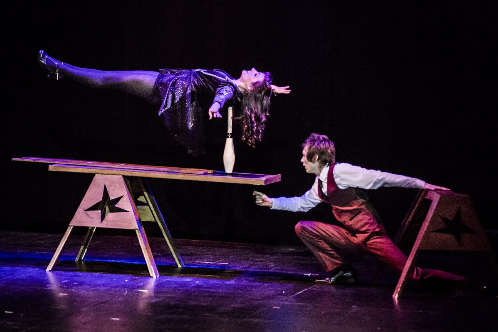 Magician Michael Jordan performing an amazing illusion on stage with wife Tamsyn (photo credit: Red Box Studios)