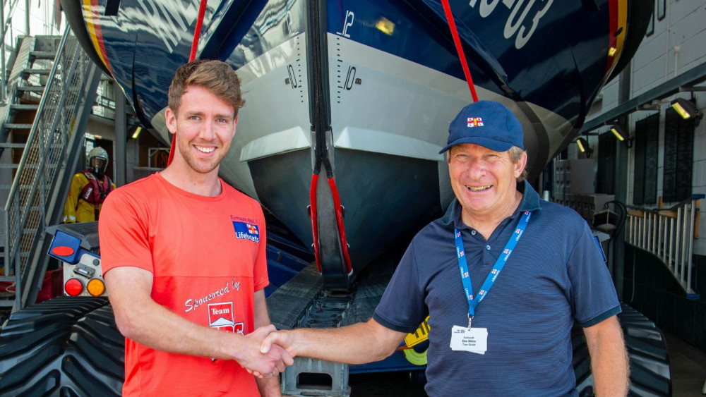 Joe Sansom with Exmouth RNLI Fundraising Chair Des White (John Thorogood/ RNLI)