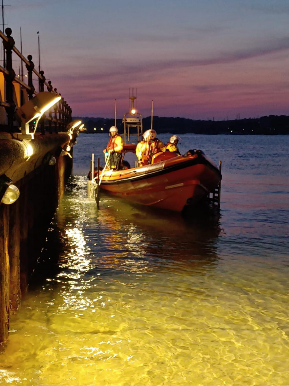The team next to the Prince of Wales Pier (Image: Falmouth Lifeboat) The team next to the Prince of Wales Pier (Image: Falmouth Lifeboat)