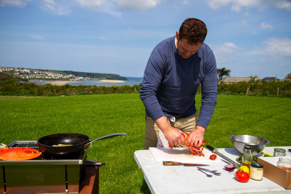 Rupert Cooper cooking up a seafood banquet in the stunning Bream Cove  (Image: Hotel Meudon) 