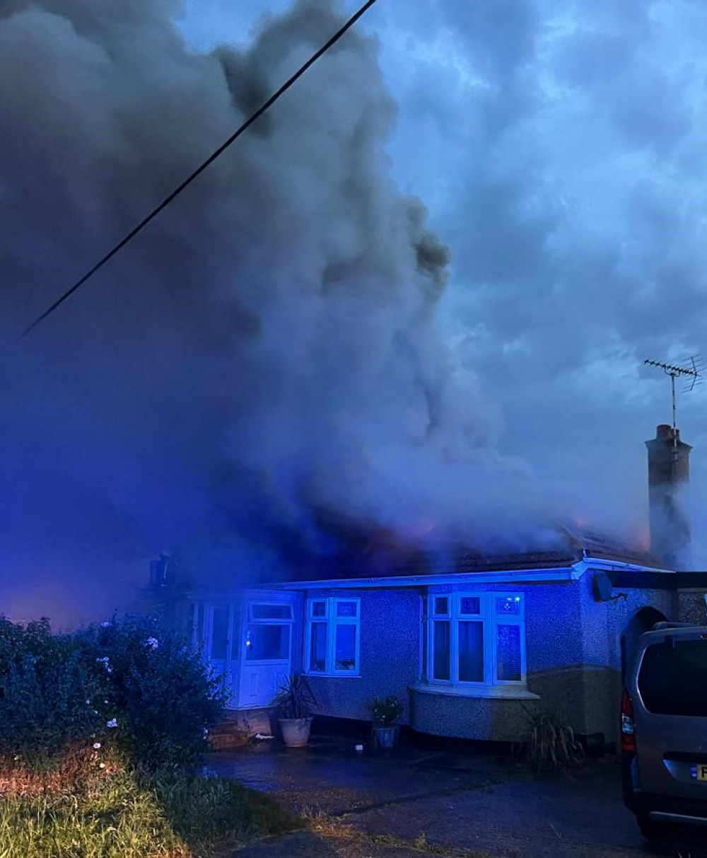 Smoke billows from the bungalow