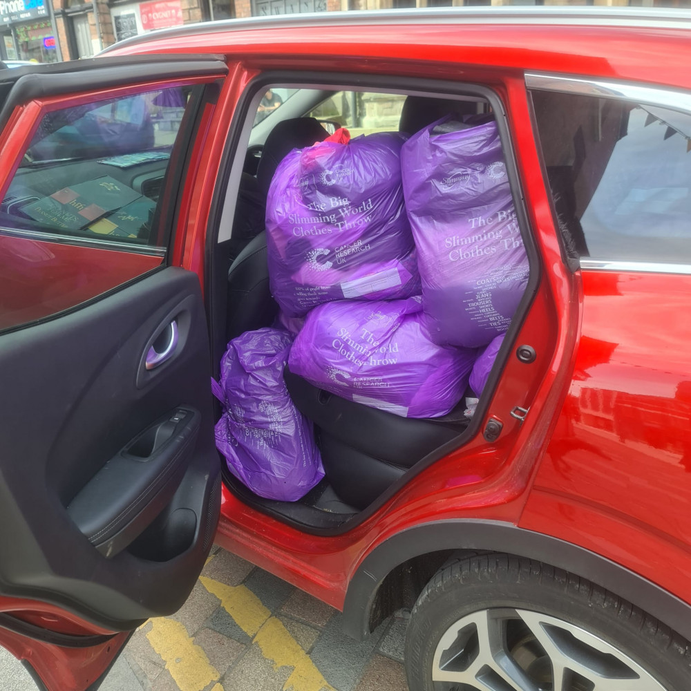 Packed to the rafters. Clothes Throw donation bags filled multiple cars ready for delivery.