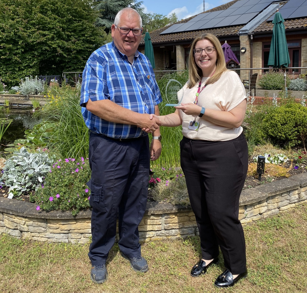 Kevin Widdick receives award from Helen Bloom - oh yes he did.. (Picture: St Elizabeth Hospice)