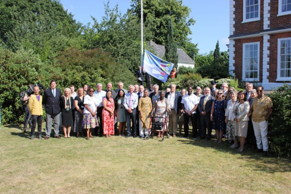 Members of the Celebrating Windrush in Devon group and Devon County Council members and officer raised the Windrush flag at County Hall in Exeter Members of the Celebrating Windrush in Devon group and Devon County Council members and officer raised the Windrush flag at County Hall in Exeter