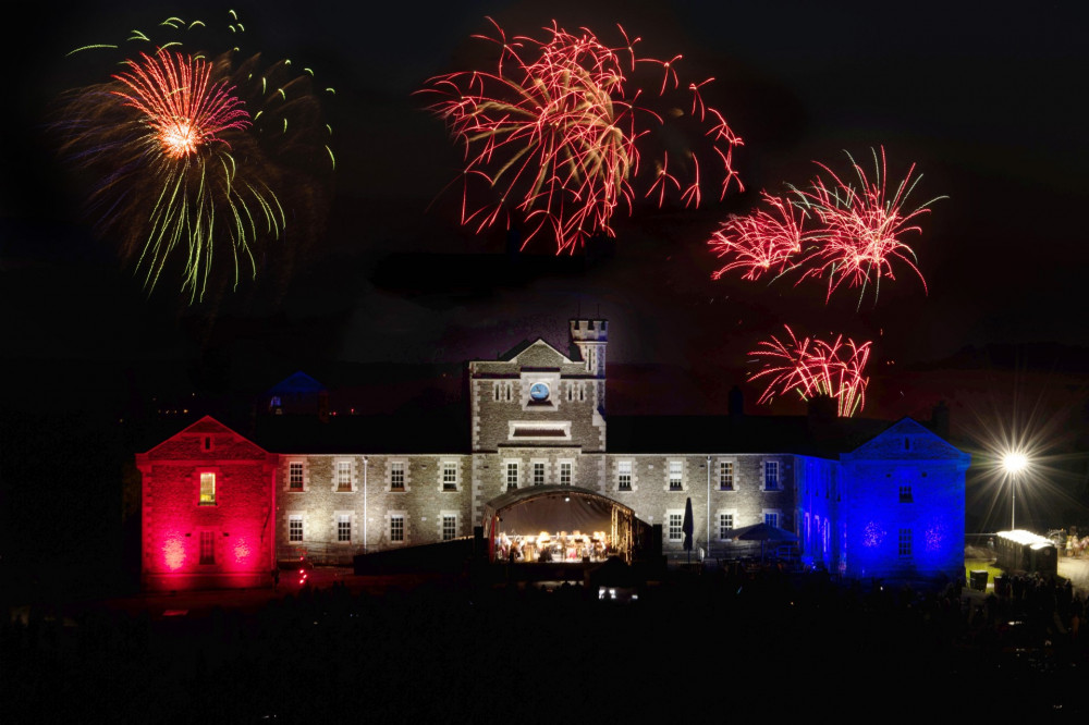 Pendennis Castle in Falmouth lit up red, white and blue during the firework celebrations for National Armed Forces Day. (Image: English Heritage) 