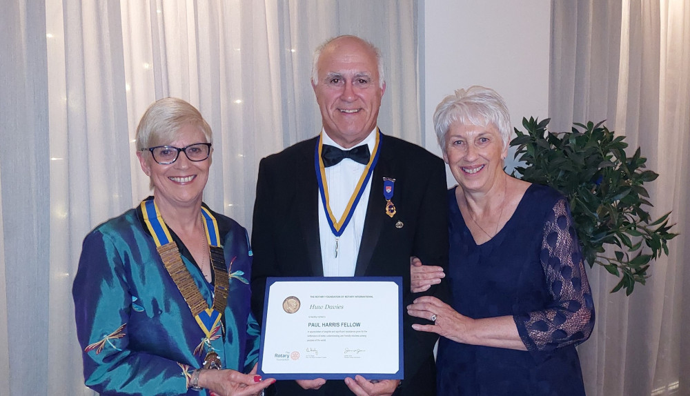 Carol Hallewell, Huw Davies and his wife Felicity with the Paul Harris Fellowship certificate. Carol Hallewell, Huw Davies and his wife Felicity with the Paul Harris Fellowship certificate.