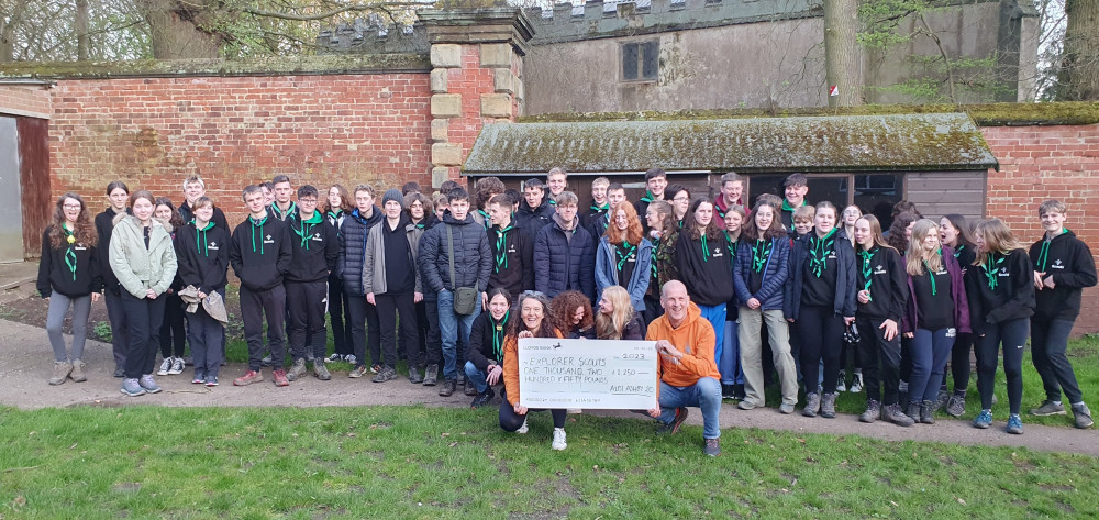 Richard Bebbington and Fiona Betts presenting a £1,250 cheque to the Explorer Scouts