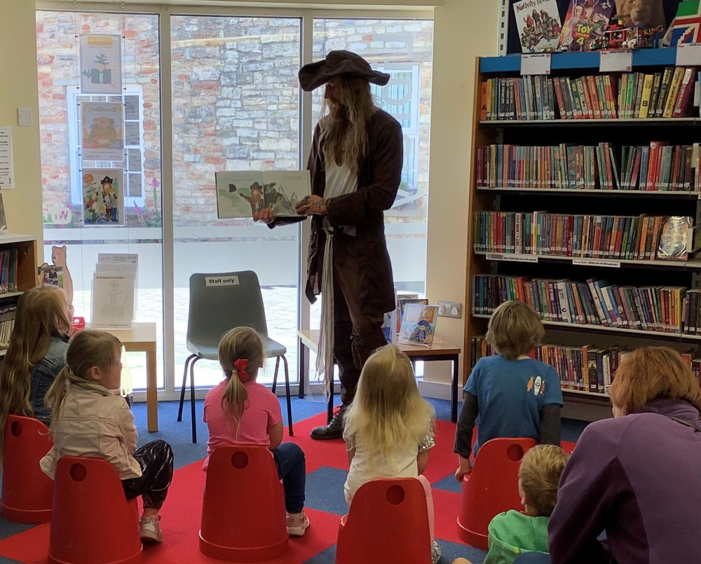 Captain Redbeard reading to children at Wells Library