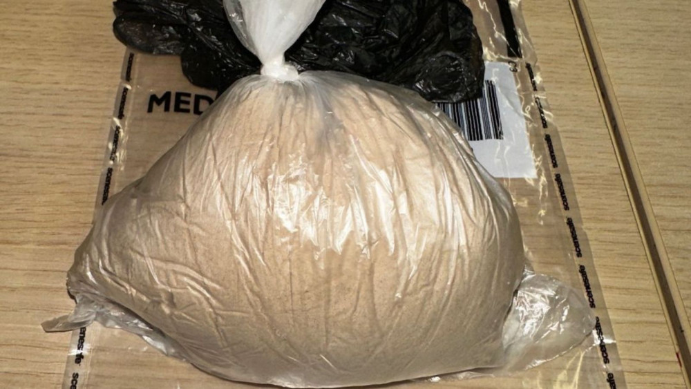 The large brown bag of powder, believed to be heroin (Teignmouth and Dawlish Police)