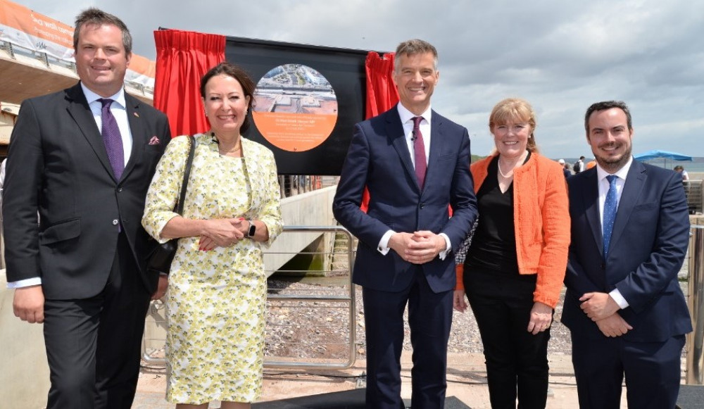 Transport Secretary Mark Harper, centre, unveiling plaque at sea wall with Dawlish's MP Anne Marie Morris, second from left, and East Devon MP Simon Jupp, right (Network Rail) Transport Secretary Mark Harper, centre, unveiling plaque at sea wall with Dawlish's MP Anne Marie Morris, second from left, and East Devon MP Simon Jupp, right (Network Rail)