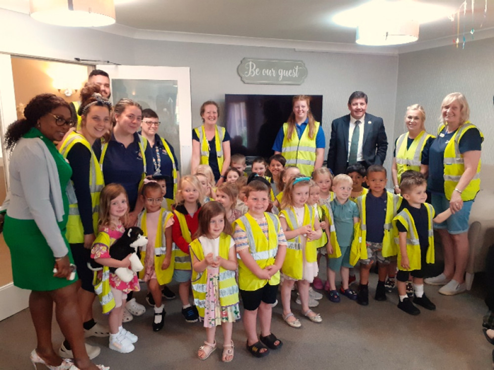 Stephen Metcalfe with Oaklands Care Home staff and children from St John's Childcare.