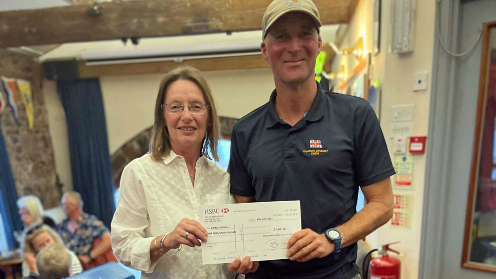 SFCC President Becky Le Milliere presents the cheque to Coxswain Steve Hockings-Thompson (RNLI)