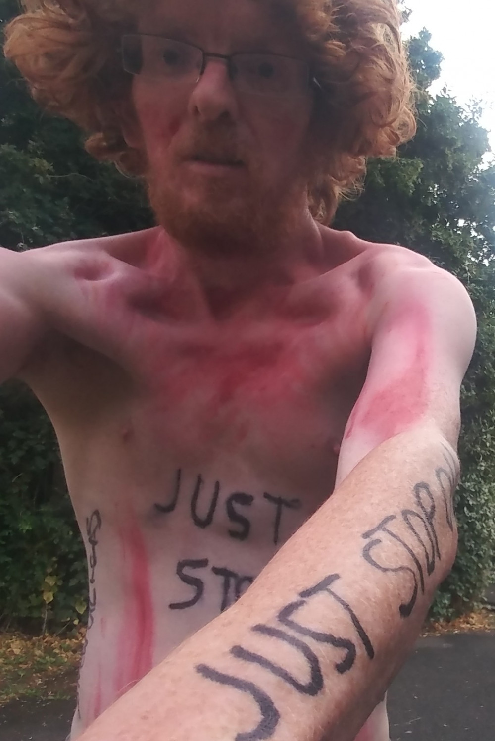 Benjamin Buse taking part in the Cardiff World Naked Bike Ride to raise awareness of vulnerability to climate breakdown and government failure.