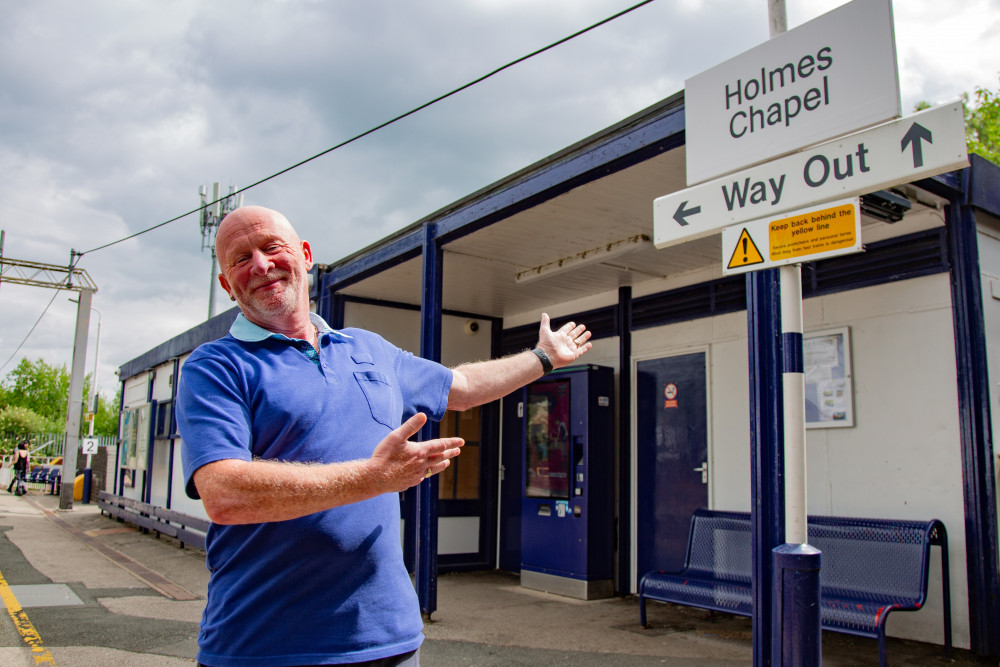 Ticket to ride ... ticket officer, Graham Blake, gives fans a Harry Styles tour map for free at the train station. (Photo: SWNS) 