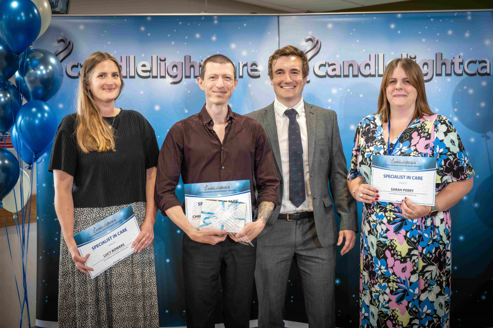 Christoff Van de Merwe (second from left) receiving his Award from James Catley-Day, Managing Director of Candlelight Care