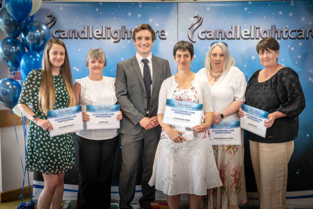 Stephanie Webb (third from right) receiving her Award from James Catley-Day, Managing Director of Candlelight Care