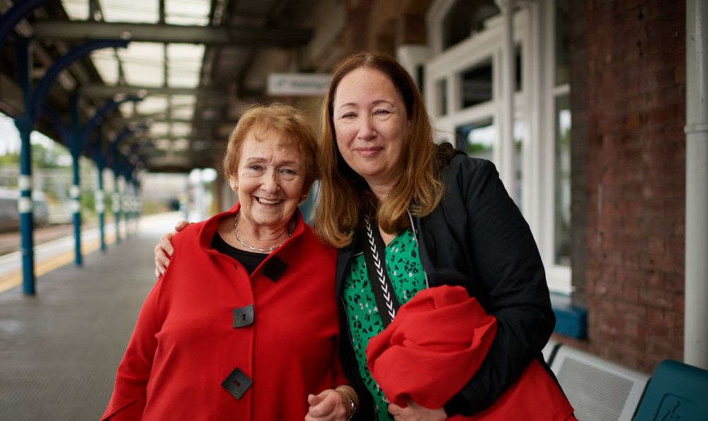 June wasn't expecting to become announcer for the day - she was brought to Stockport by her daughter Cari (right) under the pretence of seeing family (Image - Avanti West Coast)