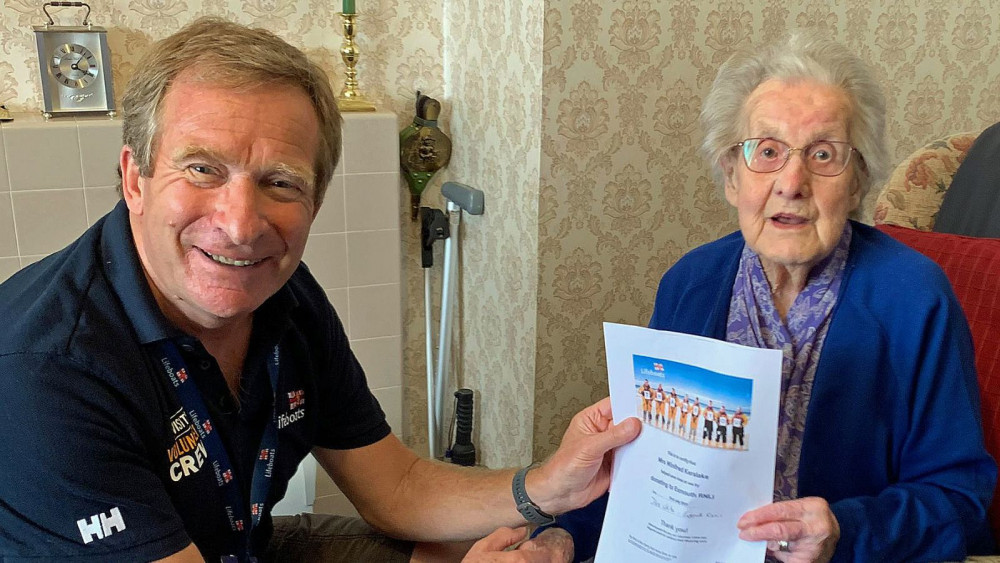 Des White presenting certificate to Winifred Kerslake (Exmouth RNLI)