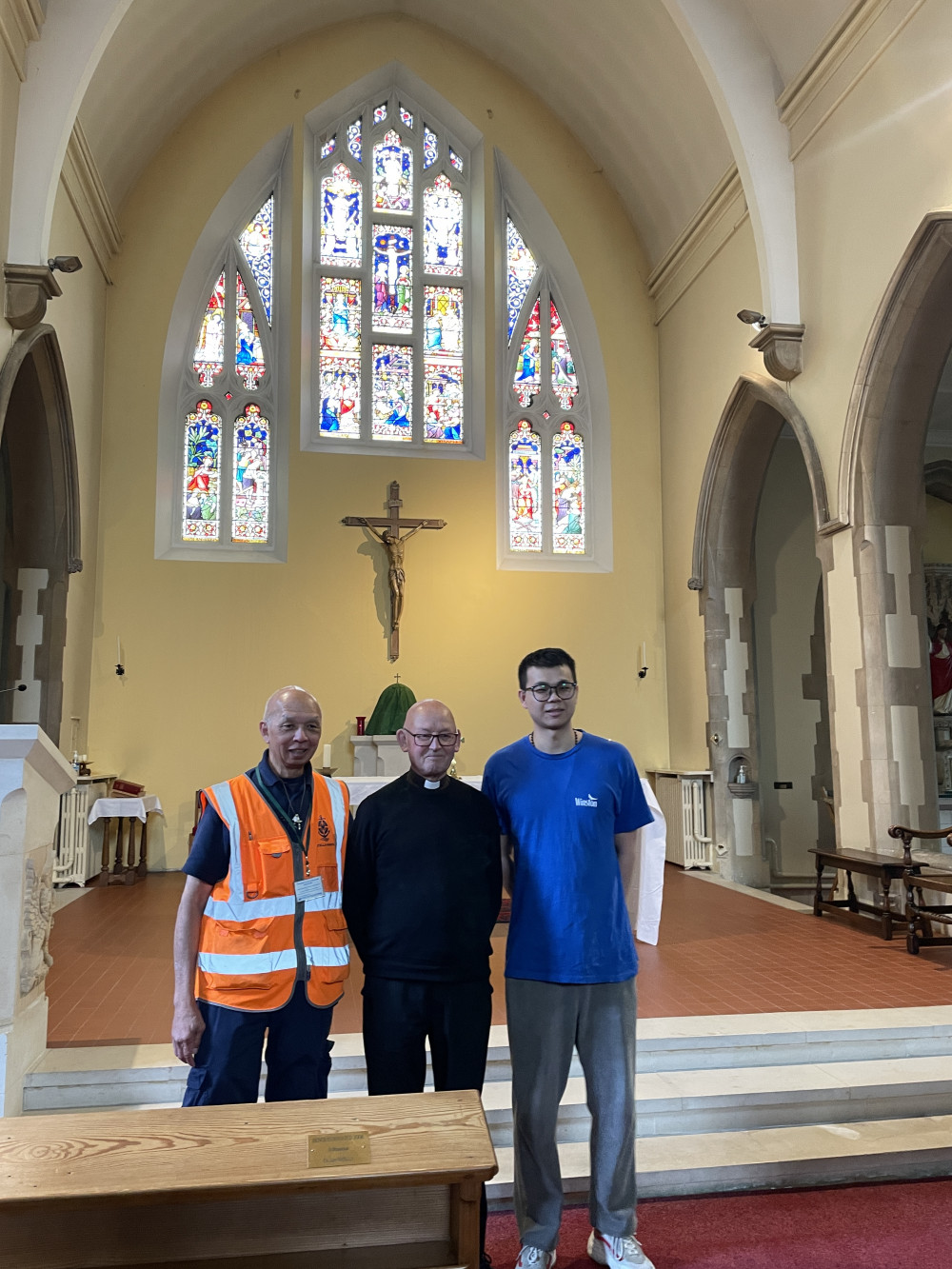 Julian Wong, left, Canon John Barnes, and Zhang in St Felix RC Church Julian Wong, left, Canon John Barnes, and Zhang in St Felix RC Church