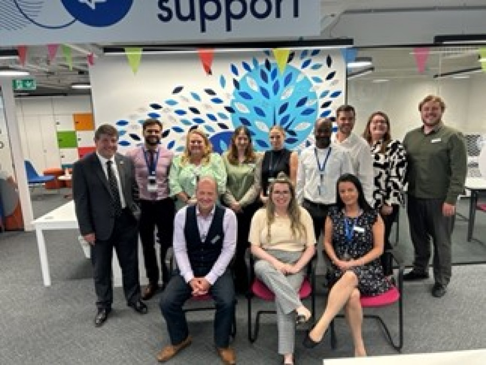 Mr Metcalfe with the Restart Scheme team in front of their success story tree.