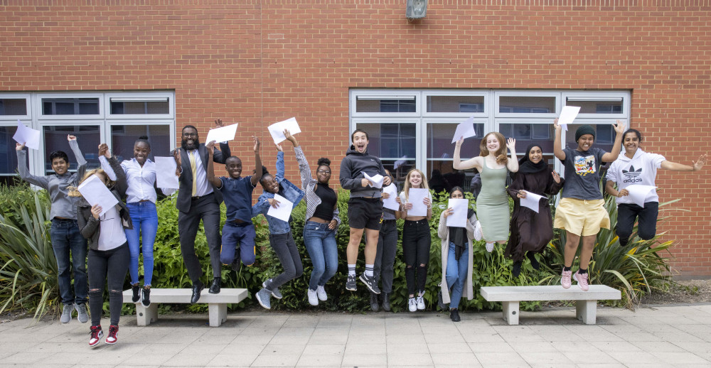 Students celebrating receiving GCSE results. (Photo: SWNS/Jim Leffman)