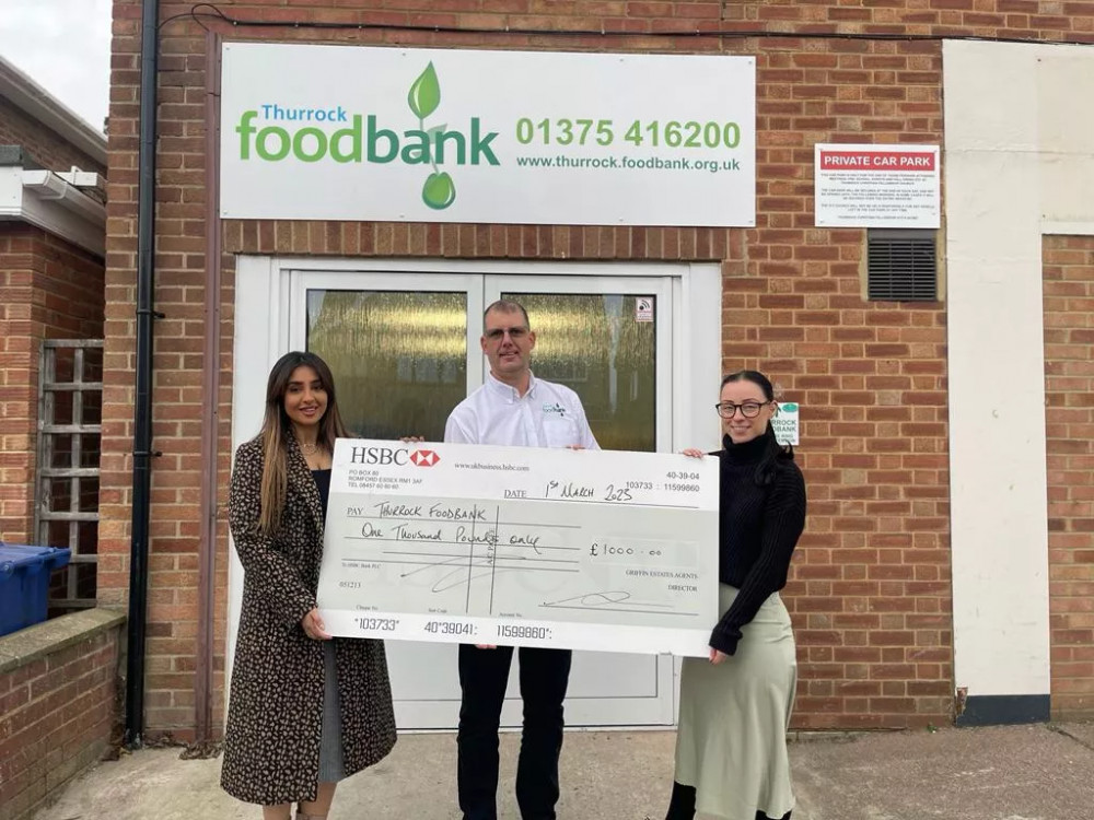 Kamila (left) and Toni (right) hand over the cheque to Peter Newall of Thurock Foodbank. 