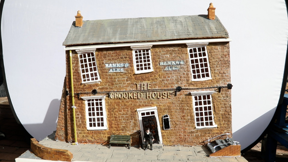 Mark Winterbottom, 50, built a miniature version of The Crooked House after it went up in flames earlier this month (SWNS).