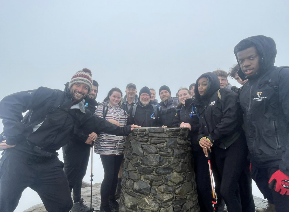 Staff from Hitchin construction company Willmott Dixon at the top of a Welsh peak