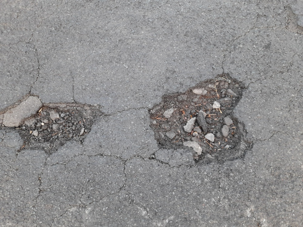 Potholes are a regular local sight and menace Potholes are a regular local sight and menace