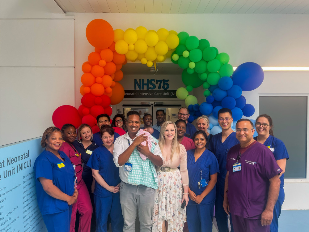   Coralie with her parents and hospital staff. Photo Credit: Chelsea and Westminster Hospital Trust