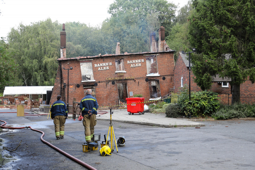 The Crooked House, in Staffordshire, was set alight earlier this month and now two men have been arrested (SWNS).