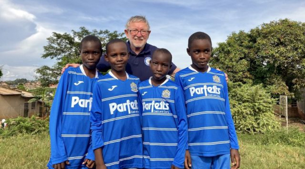 Keith and his wife Jeanette are behind a myriad of projects in Uganda - one of which is a football academy. The players are seen sporting a County kit (Image - FFoU) 