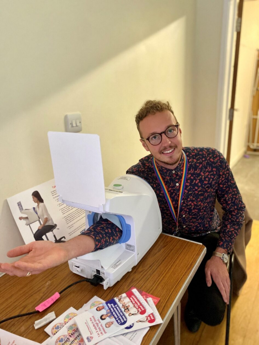 Cllr Adam Dance having his blood pressure checked